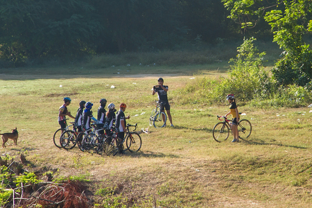 Kanchanaburi, Thailand - December, 25, 2016 : Unidentified The cyclists were gathered group take photos with smart phone in the morning light at Kanchanaburi,Thailandのeditorial素材