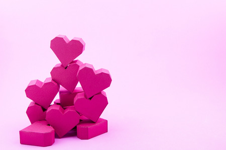 Stack of paper box red heart shape on pink background with copy space for your text.Concept Valentine's Day, Day of love.の写真素材