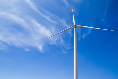 Power of wind turbine generating electricity clean energy with cloud background on the blue sky.Global ecology.Clean energy concept save the worldの写真素材