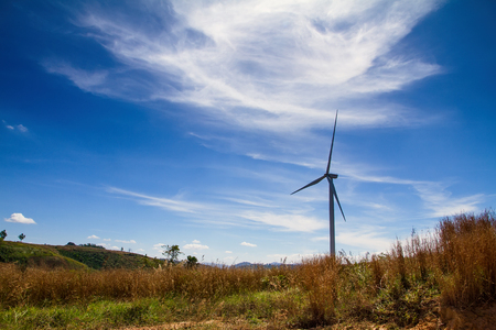 Power of wind turbine generating electricity clean energy with cloud background on the blue sky.Global ecology.Clean energy concept save the worldの写真素材