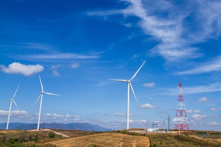 Power of wind turbine generating electricity clean energy with cloud background on the blue sky.Global ecology.Clean energy concept save the worldの写真素材