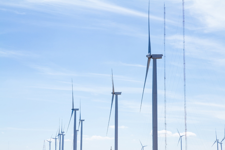 Power of wind turbine generating electricity clean energy with cloud background on the blue sky.Global ecology.Clean energy concept save the worldの写真素材