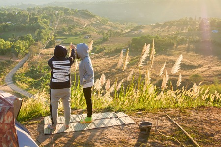 Phetchabun, Thailand - January, 22, 2017 : Tourist Camping on the hill with sunshine in the sunrise at Takhian Ngoa Mountain Phetchabun, Thailand.Natural summer landscape.のeditorial素材