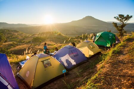 Phetchabun, Thailand - January, 22, 2017 : Tourist Camping on the hill with sunshine in the sunrise at Takhian Ngoa Mountain Phetchabun, Thailand.Natural summer landscape.のeditorial素材