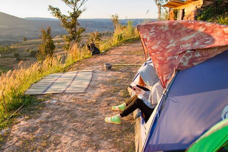 Phetchabun, Thailand - January, 22, 2017 : Tourist Camping on the hill with sunshine in the sunrise at Takhian Ngoa Mountain Phetchabun, Thailand.Natural summer landscape.のeditorial素材