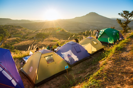 Phetchabun, Thailand - January, 22, 2017 : Tourist Camping on the hill with sunshine in the sunrise at Takhian Ngoa Mountain Phetchabun, Thailand.Natural summer landscape.のeditorial素材