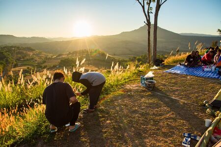 Phetchabun, Thailand - January, 22, 2017 : Tourist Camping on the hill with sunshine in the sunrise at Takhian Ngoa Mountain Phetchabun, Thailand.Natural summer landscape.のeditorial素材
