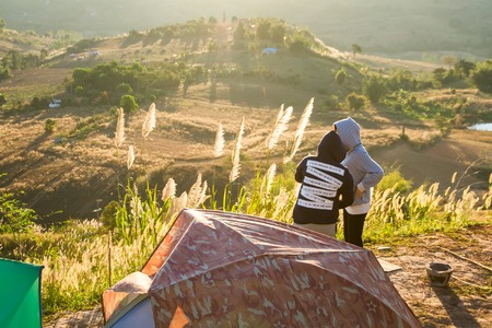 Phetchabun, Thailand - January, 22, 2017 : Tourist Camping on the hill with sunshine in the sunrise at Takhian Ngoa Mountain Phetchabun, Thailand.Natural summer landscape.のeditorial素材