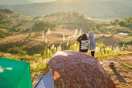 Phetchabun, Thailand - January, 22, 2017 : Tourist Camping on the hill with sunshine in the sunrise at Takhian Ngoa Mountain Phetchabun, Thailand.Natural summer landscape.のeditorial素材