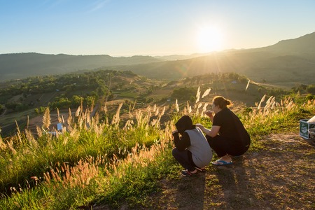 Phetchabun, Thailand - January, 22, 2017 : Tourist Camping on the hill with sunshine in the sunrise at Takhian Ngoa Mountain Phetchabun, Thailand.Natural summer landscape.のeditorial素材