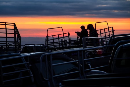 Phetchabun, Thailand - January, 21, 2017 : Silhouettes of photographer are shooting sunrise on the back of the truck at Phu Lom Lo, Phu Hin Rong Kla National Park, Phetchabun, Thailand.のeditorial素材