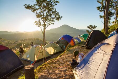 Phetchabun, Thailand - January, 22, 2017 : Tourist Camping on the hill with sunshine in the sunrise at Takhian Ngoa Mountain Phetchabun, Thailand.Natural summer landscape.のeditorial素材