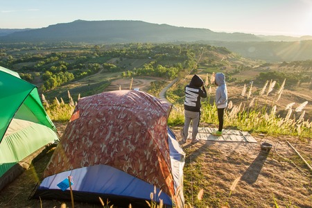 Phetchabun, Thailand - January, 22, 2017 : Tourist Camping on the hill with sunshine in the sunrise at Takhian Ngoa Mountain Phetchabun, Thailand.Natural summer landscape.のeditorial素材