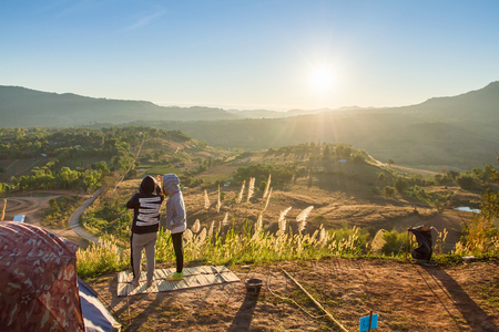 Phetchabun, Thailand - January, 22, 2017 : Tourist Camping on the hill with sunshine in the sunrise at Takhian Ngoa Mountain Phetchabun, Thailand.Natural summer landscape.のeditorial素材