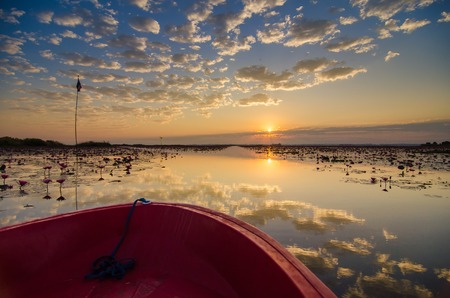 Fantastic landscape, multicolor sky over the lake. majestic sunrise. use as background. color in nature. beautiful in nature. series with many color variations.The reflection of the sky in waterの写真素材