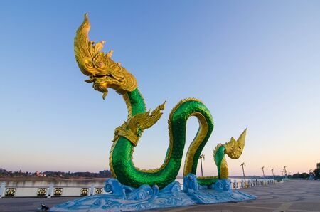 Nongkhai, Thailand - February, 05, 2017 : The golden of naga statue at Mekong Riverside morning sunrise at Nongkhai, Thailandのeditorial素材