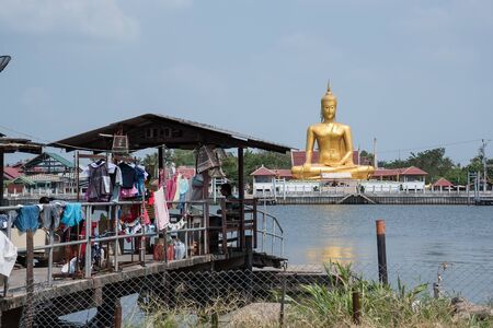 Nonthaburi, Thailand - February, 22, 2017 : The view of big golden buddha in Wat Bang Chak be side the Chao Phra Ya river at Koh Kret Nonthaburi, Thailandのeditorial素材