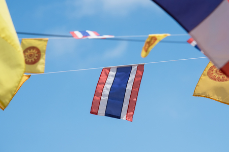 Thai flags and buddhism yellow flags in the templeの写真素材