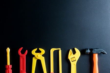 Construction tools toy on black background with copy space.Home Repair concept, Repair maintenance concept, Renovation conceptの写真素材