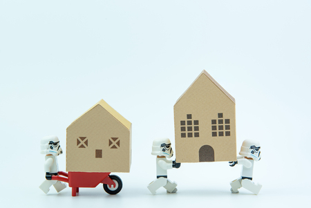 Nonthaburi, Thailand - March, 07, 2017 : Lego star wars stormtrooper help together carry the paper house.Real estate concept, New house concept.のeditorial素材
