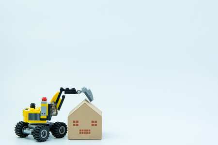 Nonthaburi, Thailand - March, 07, 2017 : Lego Toy excavator and paper house on isolated on white backgroundのeditorial素材