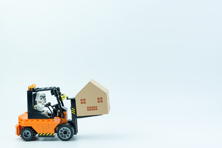 Nonthaburi, Thailand - March, 07, 2017 : Lego star wars stormtrooper transport paper house with forklift.Real estate concept, New house concept.のeditorial素材