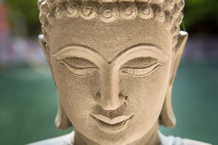 Ayutthaya, Thailand - March, 11, 2017 : Close up face of Buddha sandstone statue in Wat cheing len temple Thailand.のeditorial素材