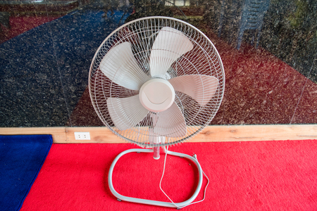 Electric fan on the floorの写真素材