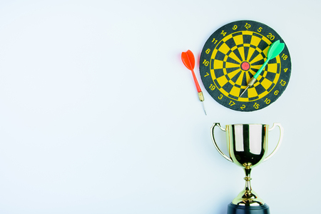 Golden trophy, Darts with crotch isolated on white background with copy space.Concept winnerの写真素材