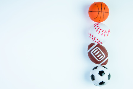 Football toy, Baseball toy, Basketball toy and Rugby toy isolated on white background with copy space.Concept winner of the sportの写真素材