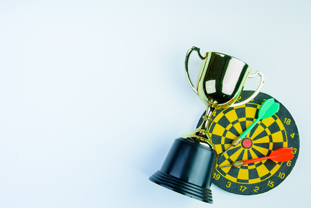 Golden trophy, Darts with crotch isolated on white background with copy space.Concept winnerの写真素材