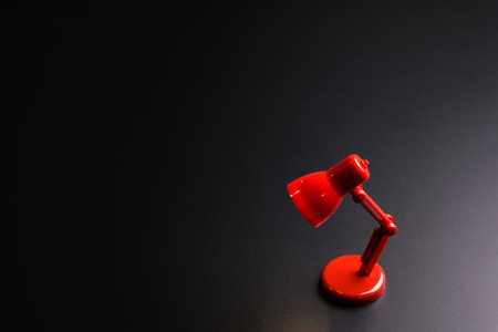 Red lamp isolated on black background with copy space image for your textの写真素材