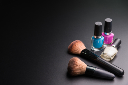 Set of flat top view of various professional female cosmetics brushes for makeup and Nail polisher isolated on black background, Cosmetics concept, Makeup concept, Copy space image for your text.の写真素材
