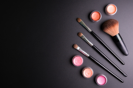 Set of flat top view of various professional female cosmetics brushes for makeup and lipstick isolated on black background, Cosmetics concept, Makeup concept, Copy space image for your text, Flat layの写真素材