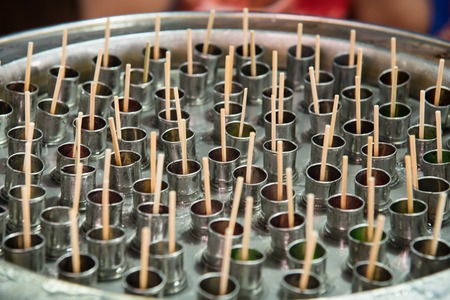 Traditional Thailand ice cream on ice cream bucket in market at Bangkok, Thailandの写真素材