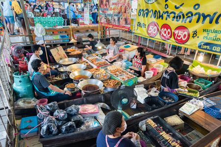 Bangkok, Thailand - April, 09, 2017 : Group of People selling fried food on the boat in Taling Chan Floating Markett at Bangkok, Thailand.のeditorial素材