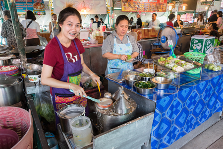 Bangkok, Thailand - April, 09, 2017 : Unidentified woman steaming food in Taling Chan Floating Markett at Bangkok, Thailand.のeditorial素材