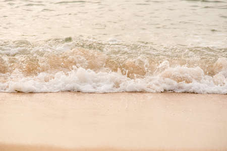 Ocean waves exhausted on the beach in the morning.の写真素材