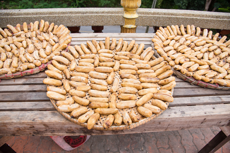 Sun-dried banana - Banana preserved by sundry method on tray - Tradition Thai foodの写真素材