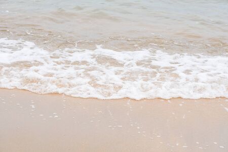 Ocean waves exhausted on the beachの写真素材