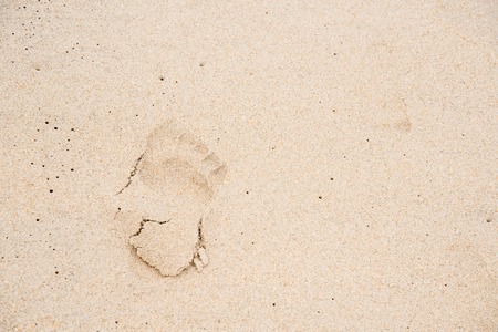 Footprints on the sand beach beachの写真素材