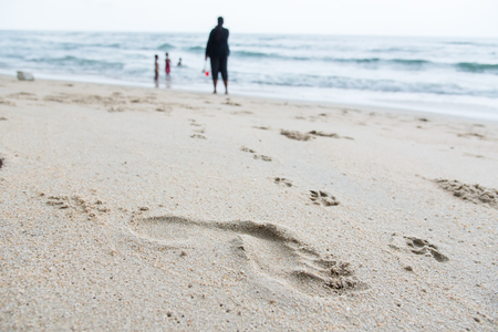 Footprints on the sand beach beachの写真素材