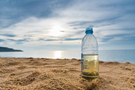 Prachuap Khiri Khan, Thailand - April, 18, 2017 : Plastic water bottle on the beach at Prachuap Khiri Khan, Thailandのeditorial素材
