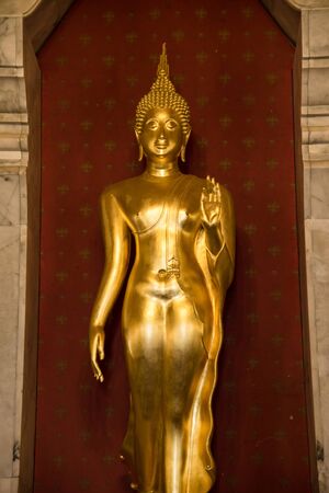 Prachuap Khiri Khan, Thailand - April, 18, 2017 : Golden Buddha statue in Wat Thang Sai on mountain Thongchai, The important temple in Baangrood, Prachuapkhirikhan Thailand.のeditorial素材