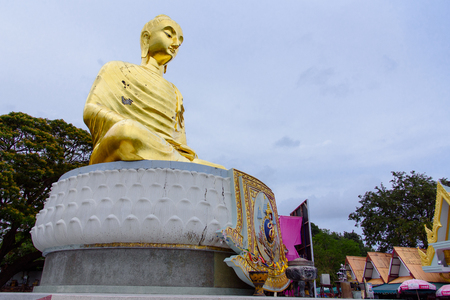 Prachuap Khiri Khan, Thailand - April, 18, 2017 : A golden Buddha statue named as Pra Buddha Kitisirichai is located at temple Wat Thang Sai on mountain Thongchai at Prachuap Khiri Khan, Thailandのeditorial素材