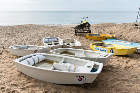 Prachuap Khiri Khan, Thailand - April, 18, 2017 : Small boats and Jet Ski on the beach at Prachuap Khiri Khan, Thailand.のeditorial素材