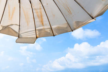 White Umbrella of Baan Sattahip Resort and sea background at Sattahip, Chon Buri, Thailand.の写真素材