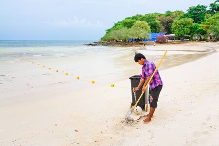 Rayong, Thailand - April, 29, 2017 : Unidentified name Workers are sweeping the leaves on the beach at the Koh Samet island, Rayong, Thailandのeditorial素材