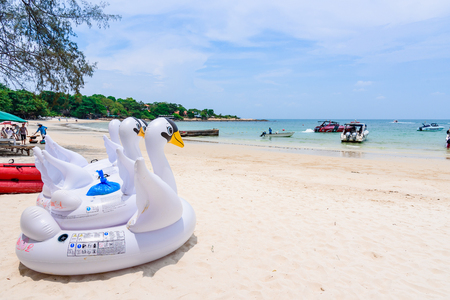 Rayong, Thailand - April, 28, 2017 : Swan swim tube on the beach Inflatable swan.Fantasy Swim Ring for Summer sea Trip on the beach at the Koh Samet island, Rayong, Thailandのeditorial素材