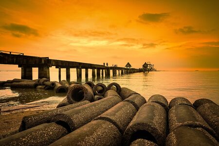Chon Buri, Pattaya, Thailand - April, 29, 2017 : Landscape of Concrete drainage pipes and old bridge in the sea at Djittabhawan temple Pattaya, Thailand.のeditorial素材